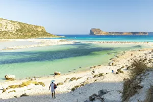 Lagoon Gallery: Tourists walking to the white sand beach surrounding Balos lagoon, Crete, Greek Islands