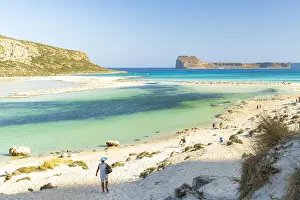 40 44 Years Prints: Tourists walking to the white sand beach surrounding Balos lagoon, Crete, Greek Islands