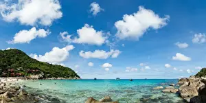 Typically Thai Prints: Toursits enjoy the clear water and sun at a beach on the Thai island of Koh Tao, Thailand
