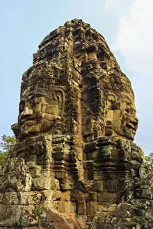 Anthropomorphic Face Prints: Tower with two of the 216 smiling sandstone faces at 12th century Bayon temple in