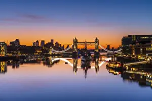 Bascule Bridge Prints: Tower Bridge, HMS Belfast and reflections in a still River Thames at sunrise