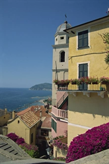 Tower and houses overlooking the coast in the town