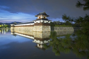 Hiroshima Prints: Tower and moat of Hiroshima castle at dusk, Hiroshima, Hiroshima Prefecture, Japan, Asia
