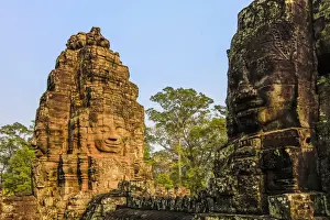 Anthropomorphic Face Prints: Towers and three of the 216 smiling sandstone faces at 12th century Bayon temple
