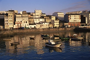 Town across fishing boat harbour