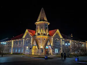Streets Prints: Town square of Naryan-Mar shines brightly at night with illuminated buildings