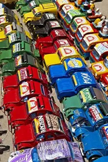 Images Dated 3rd December 2007: Toy cars made with metal food box and sold on the National 7 road, Madagascar, Africa