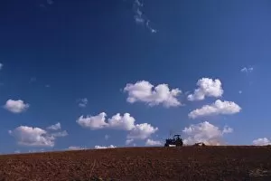 Tractor crossing field, Cuba, West Indies, Central America