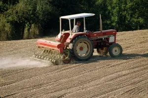 Machinery Prints: A tractor with a seed drill, drilling rape seed in autumn in the Tarn, France, Europe