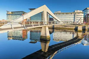 Footbridge Prints: Tradeston Bridge (Squiggly Bridge), footbridge reflecting over the River Clyde, Glasgow