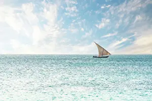 Zanzibar Prints: Traditional African dhow sailing in the calm waters of the Indian Ocean