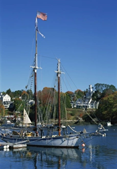 Masts Prints: Traditional boat flying the Stars & Stripes, moored in the harbour at Rockport