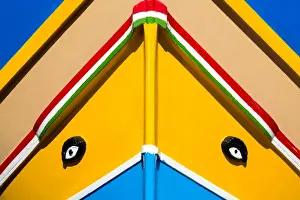 Detail of traditional brightly painted fishing boat in the harbour at Marsaxlokk