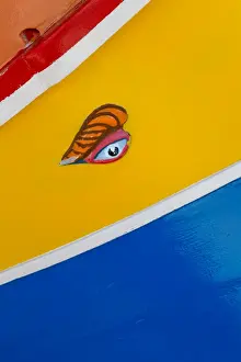 Bright Colour Prints: Detail of traditional brightly painted fishing boat in the harbour at Marsaxlokk