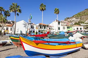Traditional colourful fishing boats on the beach in Camara de Lobos fishing village