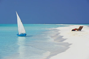 Chair Prints: Traditional dhoni and lounge chairs on beach, Maldives, Indian Ocean, Asia