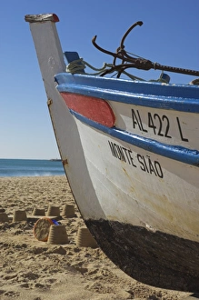 Images Dated 24th January 2000: Traditional fishing boat and sand castles
