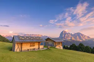 Huts Prints: Traditional huts at sunset with Sassolungo and Sella Group in the background