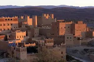 Kasbah Prints: Traditional kasbahs (fortified houses) bathed in evening light in the town of Nkob