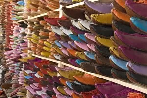 Traditional leather shoes on sale in a shop next to the tannery, Fez, Morocco
