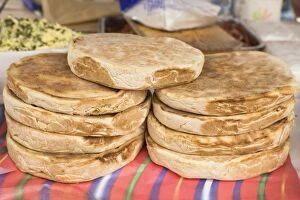 Images Dated 17th January 2010: Traditional Madeiran flat bread is cooked and served at a stall in Funchal