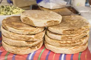 Funchal Prints: Traditional Madeiran flat bread is cooked and served at a stall in Funchal