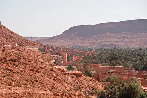 Grove Prints: Traditional mudbrick village nestled in the Ziz Valley with lush palm grove and red desert cliffs