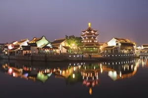 Images Dated 9th January 2008: Traditional old riverside houses and pagoda illuminated at night in Shantang water town