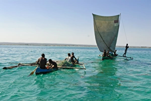 Images Dated 21st August 2007: Traditional sailing boat and rowing boat in the turquoise water of the Indian Ocean