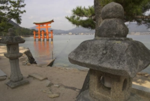 Shinto Prints: Traditional stone candle stands in foreground