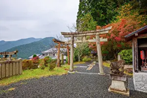 Gates Prints: Traditional torii gates surrounded by vivid autumn foliage on Mount Hiei