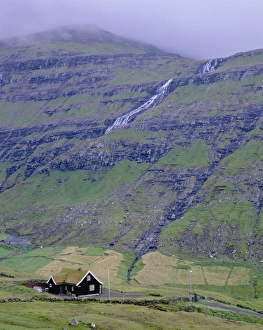 Images Dated 21st September 2009: Traditional turf roofed house and hills at Saksun, Streymoy Island, Faroe Islands