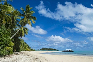 Holidays Prints: Traditional wood carved boat in the Aitutaki lagoon, Rarotonga and the Cook Islands
