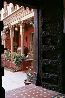 Restored Prints: Traditional wood door and 19th century floor tiles