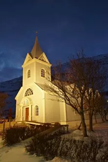 Traditional wooden church at night, built in 1922, at Seydisfjordur, a town founded in 1895 by a Norwegian fishing