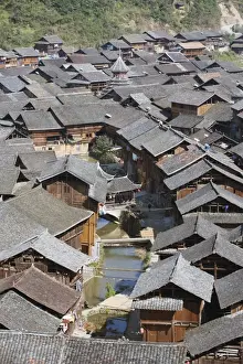 Ethnic Prints: Traditional wooden houses in Zhaoxing Dong ethnic village, Guizhou Province, China, Asia