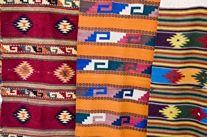 Blanket Prints: Traditional woven fabrics in tourist shops