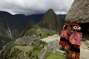 Images Dated 20th November 2010: Traditionally dressed children looking over the ruins of the Inca city of Machu Picchu