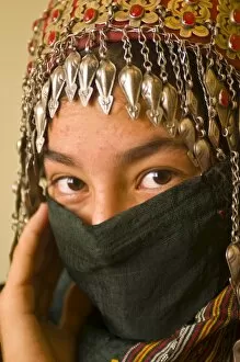 Traditionally dressed young girl behind a veil, Ashgabad, Turkmenistan