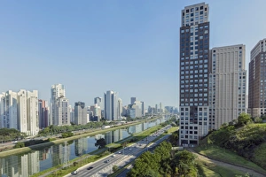 Traffic on Marginal Pinheiros urban highway, the Pinheiros Rriver and skyline of
