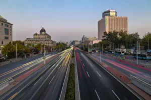 Traffic trail lights on major road near Beijing Zoo at dusk, Beijing, People s