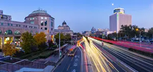Traffic trail lights on major road near Beijing Zoo at dusk, Beijing, People s