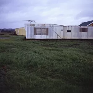 Trailer home with antenna on grassy lawn, Vashon Island, Washington State