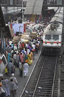 New Delhi Prints: Train ariving at crowded platform in New Delhi train station
