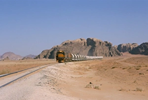Approaching Prints: Train on railway in the desert
