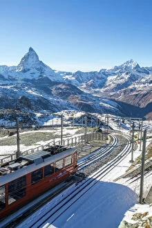 Switzerland Gallery: A train from Zermatt approaching the Gornergrat Station facing the majestic shape of