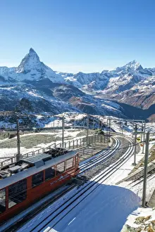 Railway Prints: A train from Zermatt approaching the Gornergrat Station facing the majestic shape of the Matterhorn