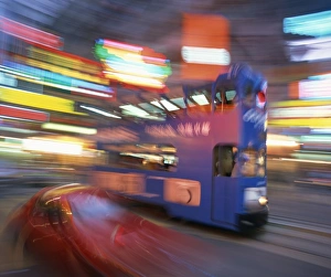 Tram in blurred motion at dusk, Causeway Bay, Hong Kong, China, Asia