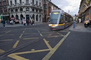 Tram crossing O Connell Street, Dublin, Republic of Ireland, Europe