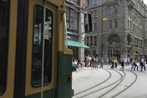 Tram and pedestrians, Mikaelsgaten, Mikonkatu Street, Helsinki, Finland